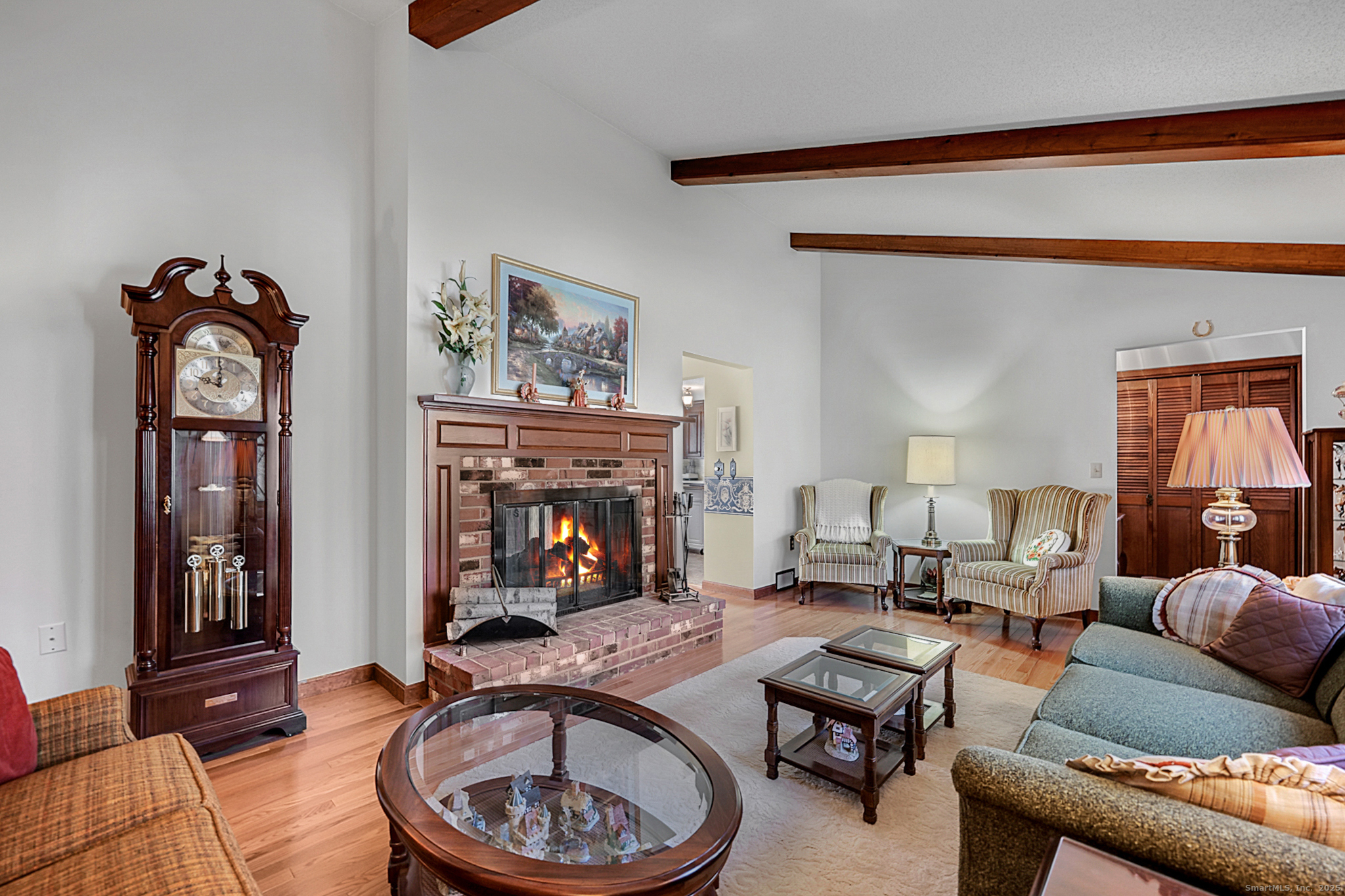 52 Wood Creek Road Burlington, CT 06013 - Photo 7 of 40 a living room with furniture and a fireplace