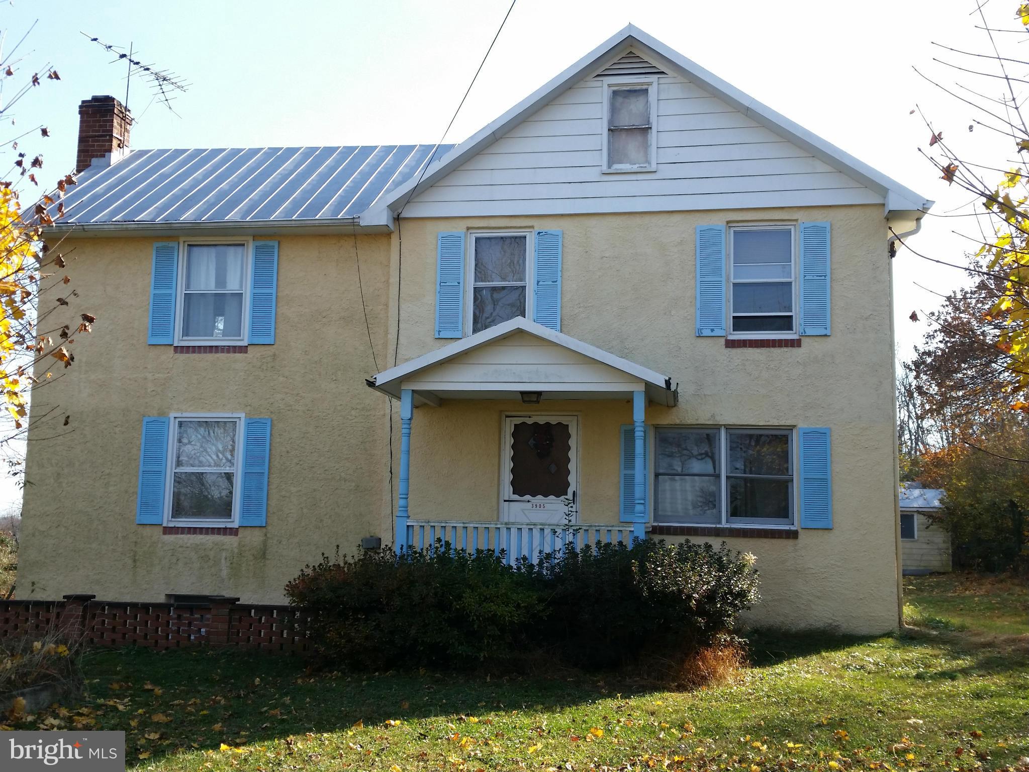 3905 Salem Bottom Road Westminster, MD 21157 - Photo 1 of 26 a front view of a house with garden