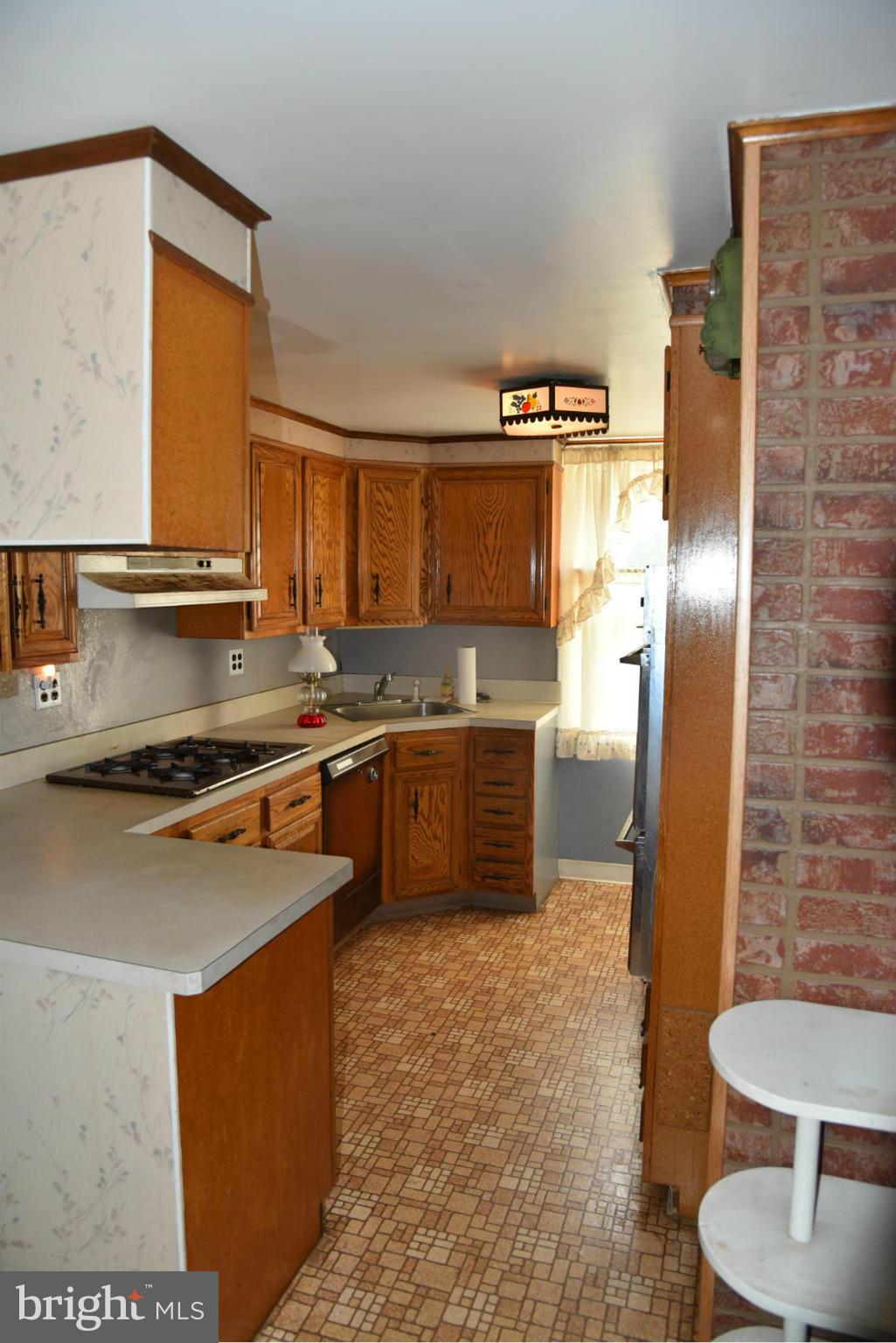 3905 Salem Bottom Road Westminster, MD 21157 - Photo 16 of 26 a kitchen with stainless steel appliances granite countertop a stove a sink and a refrigerator
