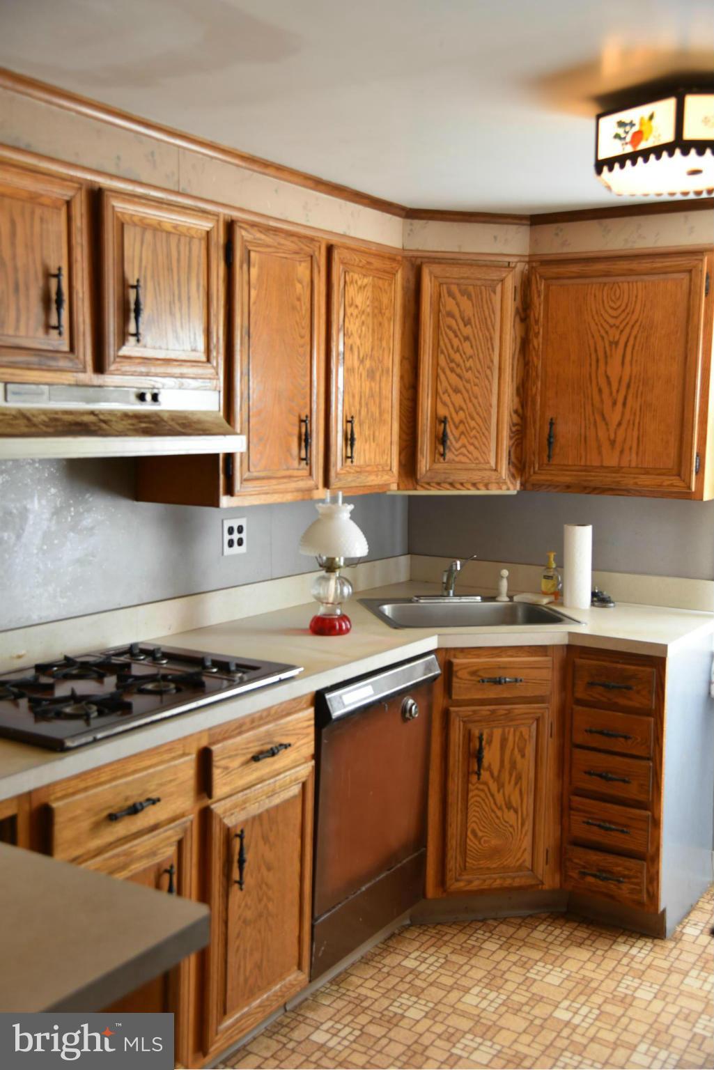 3905 Salem Bottom Road Westminster, MD 21157 - Photo 17 of 26 a kitchen with stainless steel appliances granite countertop a stove and a sink