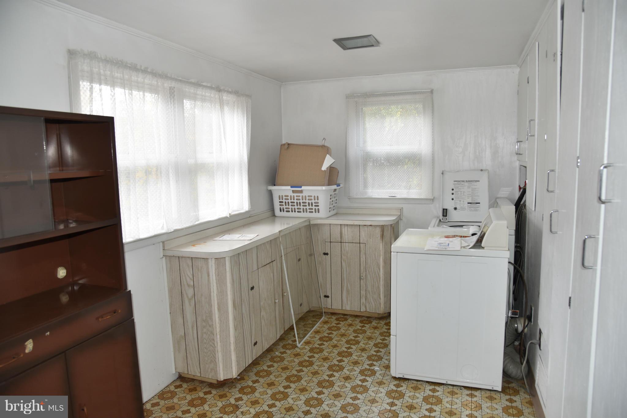 3905 Salem Bottom Road Westminster, MD 21157 - Photo 26 of 26 a room with a sink washer and dryer