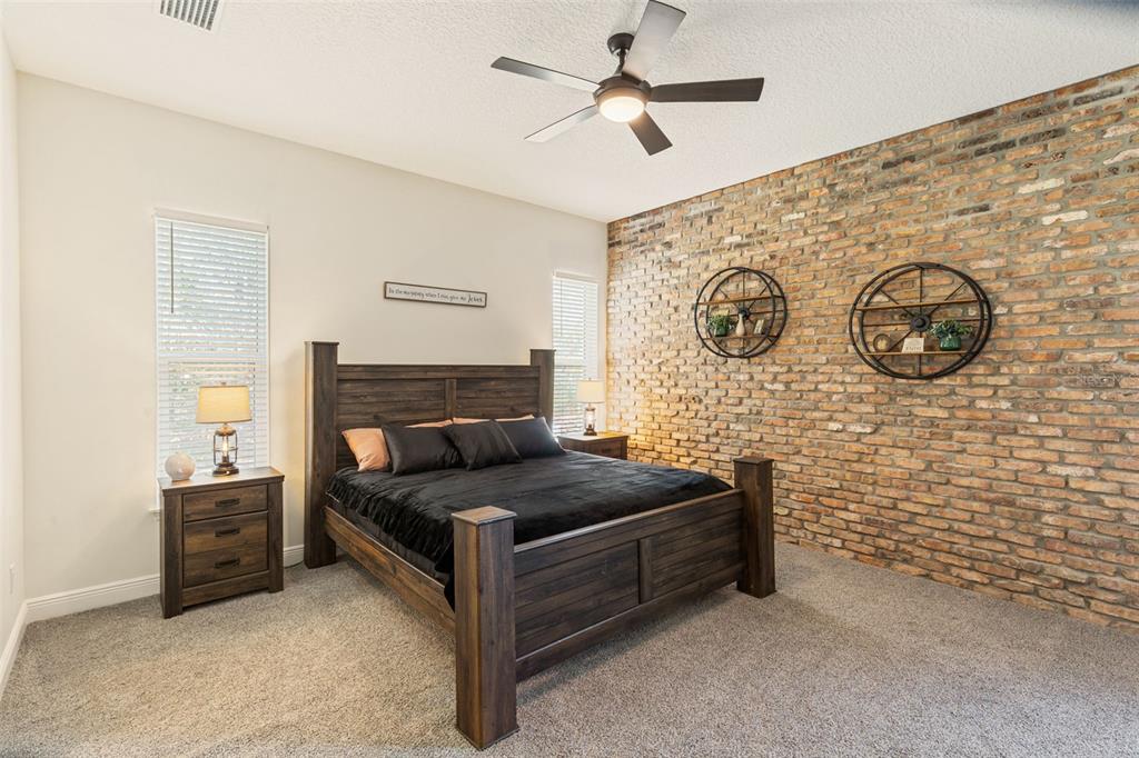 6206 Five Acre Road Plant City, FL 33565 - Photo 13 of 33 a living room with furniture and a wall painting