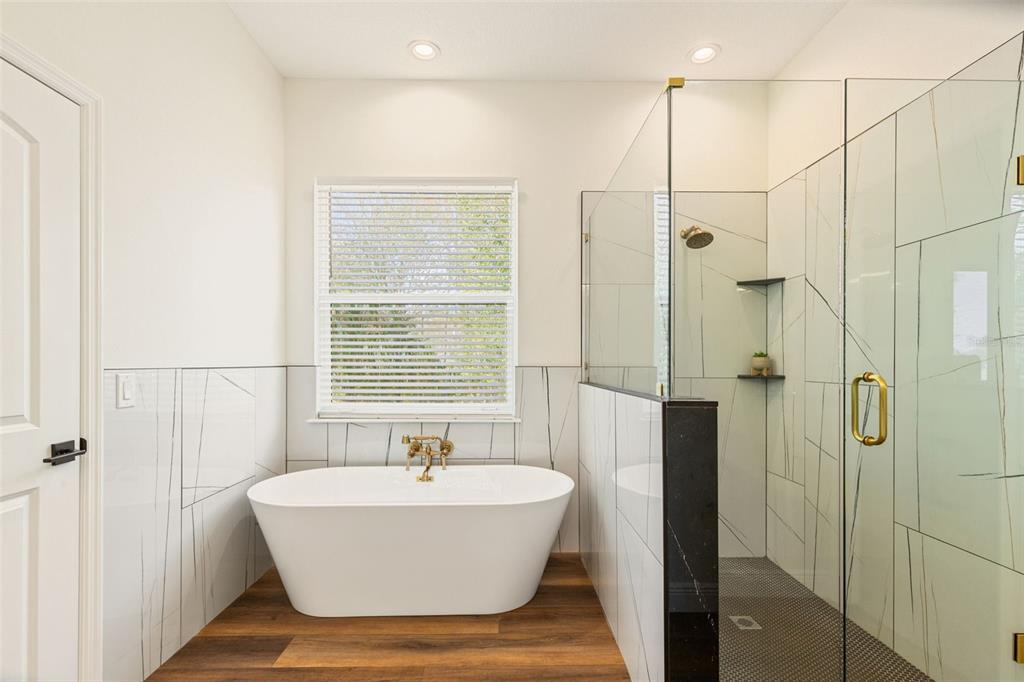 6206 Five Acre Road Plant City, FL 33565 - Photo 15 of 33 a bathroom with a bathtub and shower