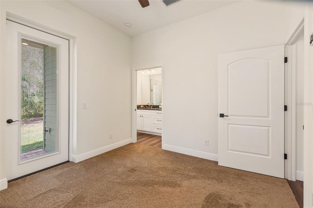 6206 Five Acre Road Plant City, FL 33565 - Photo 19 of 33 an empty room with windows and closet