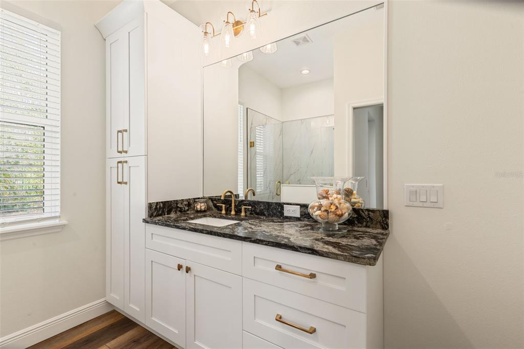 6206 Five Acre Road Plant City, FL 33565 - Photo 20 of 33 a bathroom with a double vanity sink and mirror