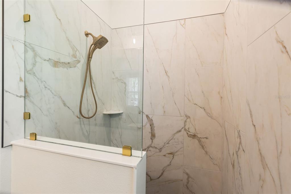 6206 Five Acre Road Plant City, FL 33565 - Photo 22 of 33 a bathroom with a shower and a shower head