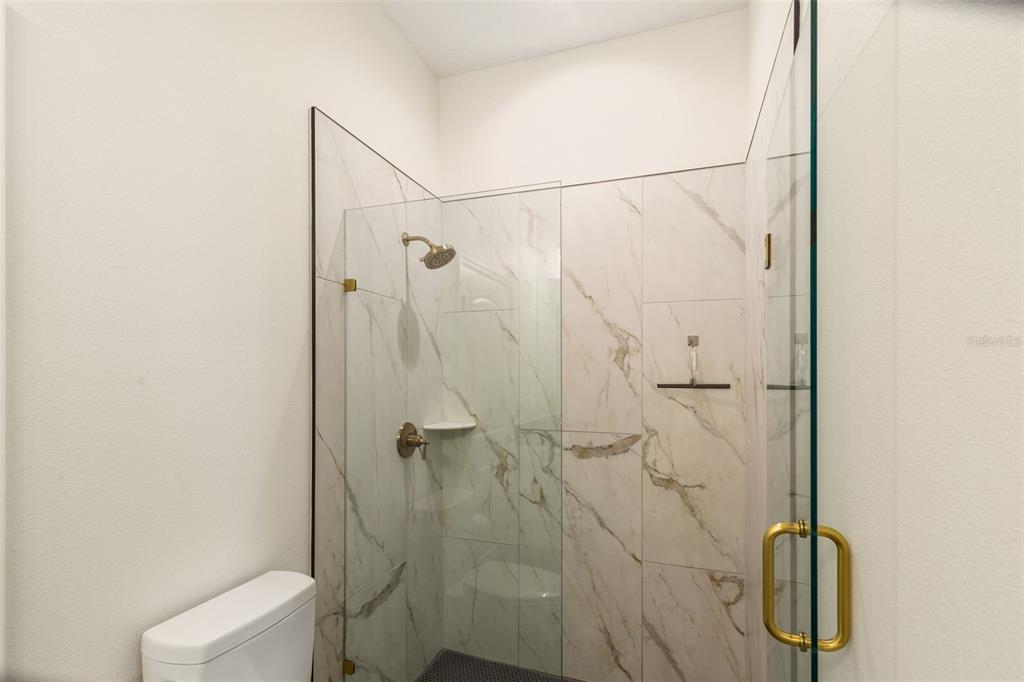 6206 Five Acre Road Plant City, FL 33565 - Photo 24 of 33 a bathroom with a shower and toilet
