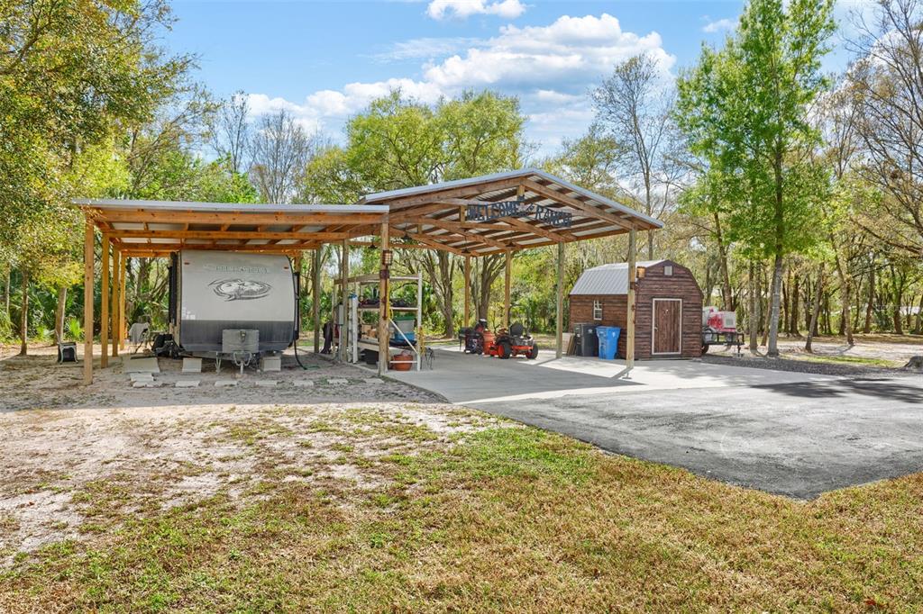 6206 Five Acre Road Plant City, FL 33565 - Photo 28 of 33 a view of a house with a patio