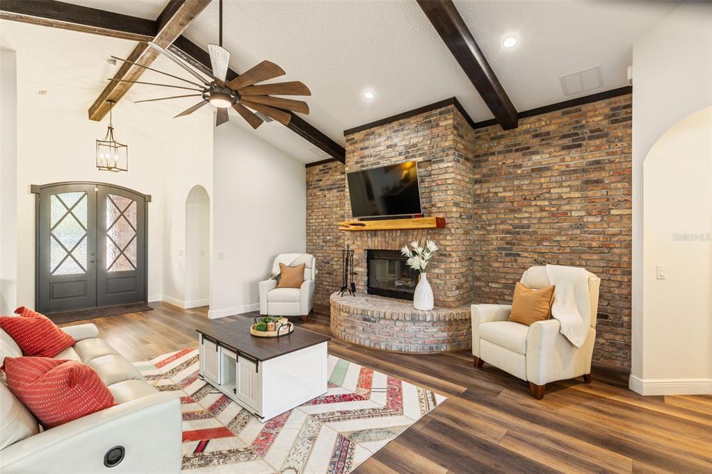 6206 Five Acre Road Plant City, FL 33565 - Photo 6 of 33 a living room with furniture and a flat screen tv