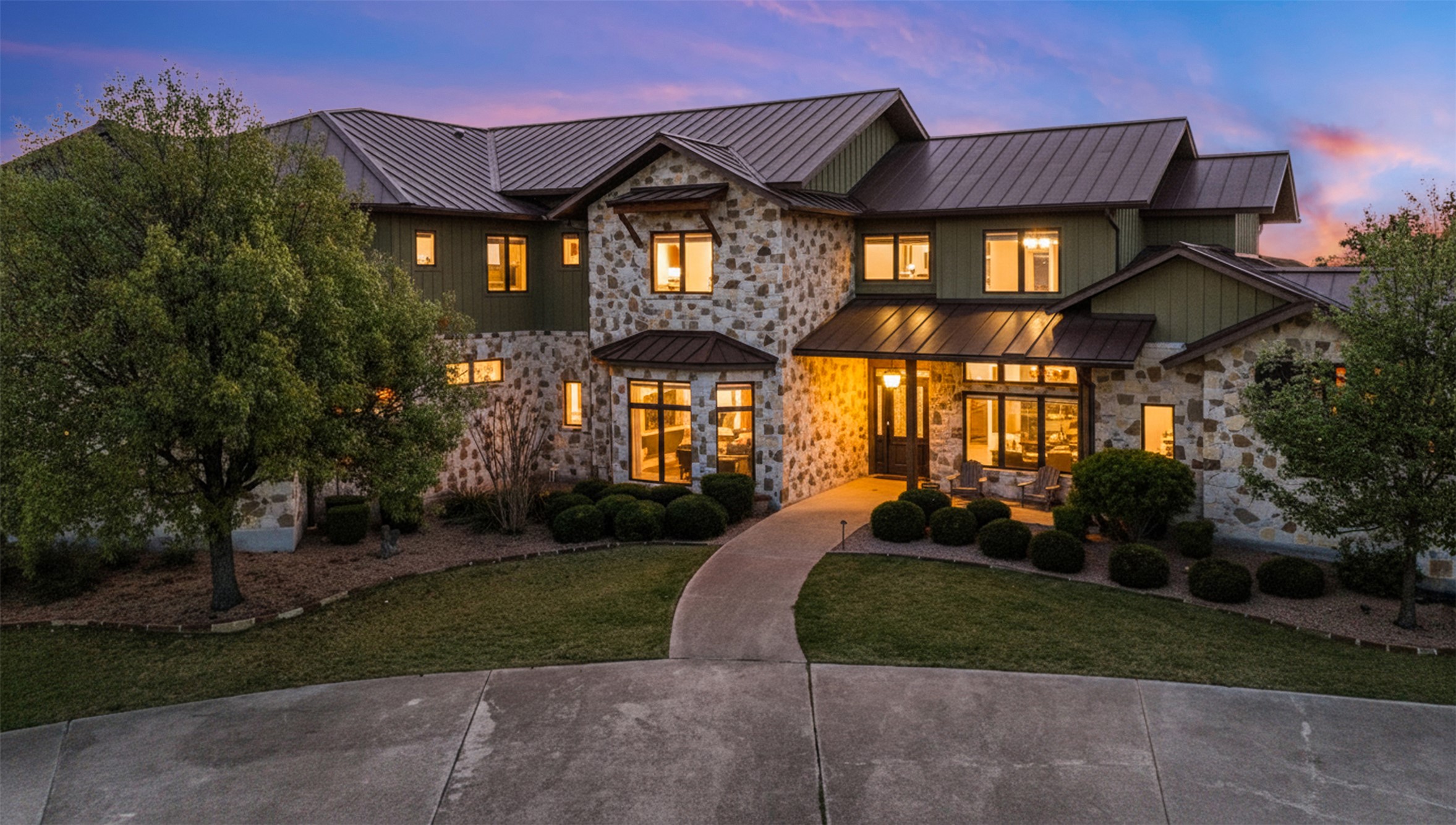 1580 Fm 3237 Wimberley, TX 78676 - Photo 2 of 40 a front view of a house with a yard and a garden