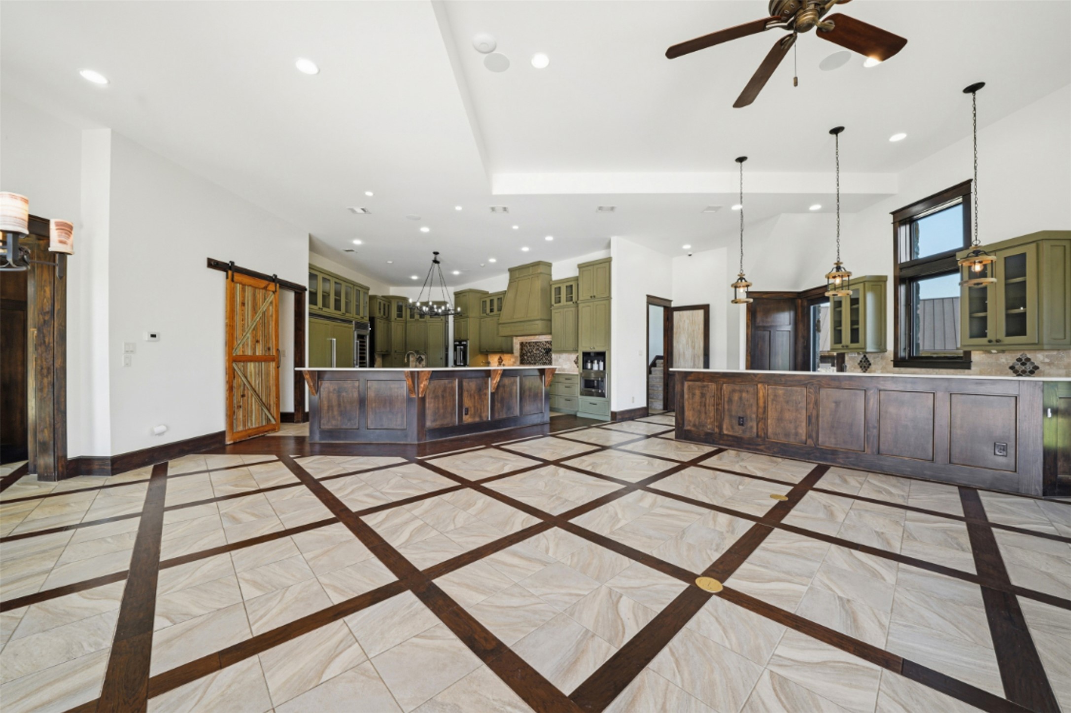 1580 Fm 3237 Wimberley, TX 78676 - Photo 23 of 40 a open kitchen with stainless steel appliances kitchen island granite countertop a refrigerator a stove and a sink with wooden floor