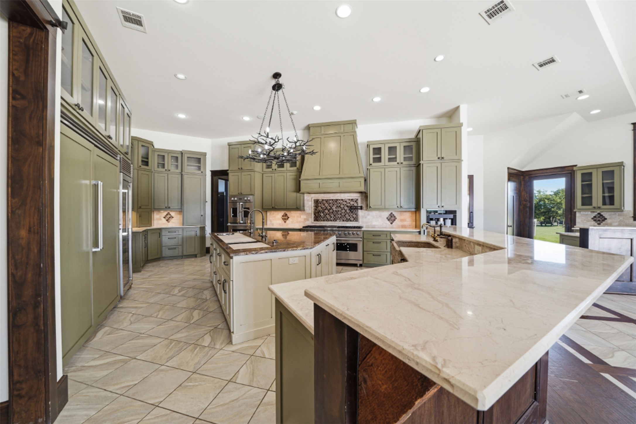 1580 Fm 3237 Wimberley, TX 78676 - Photo 25 of 40 a large kitchen with a counter space a sink appliances and cabinets