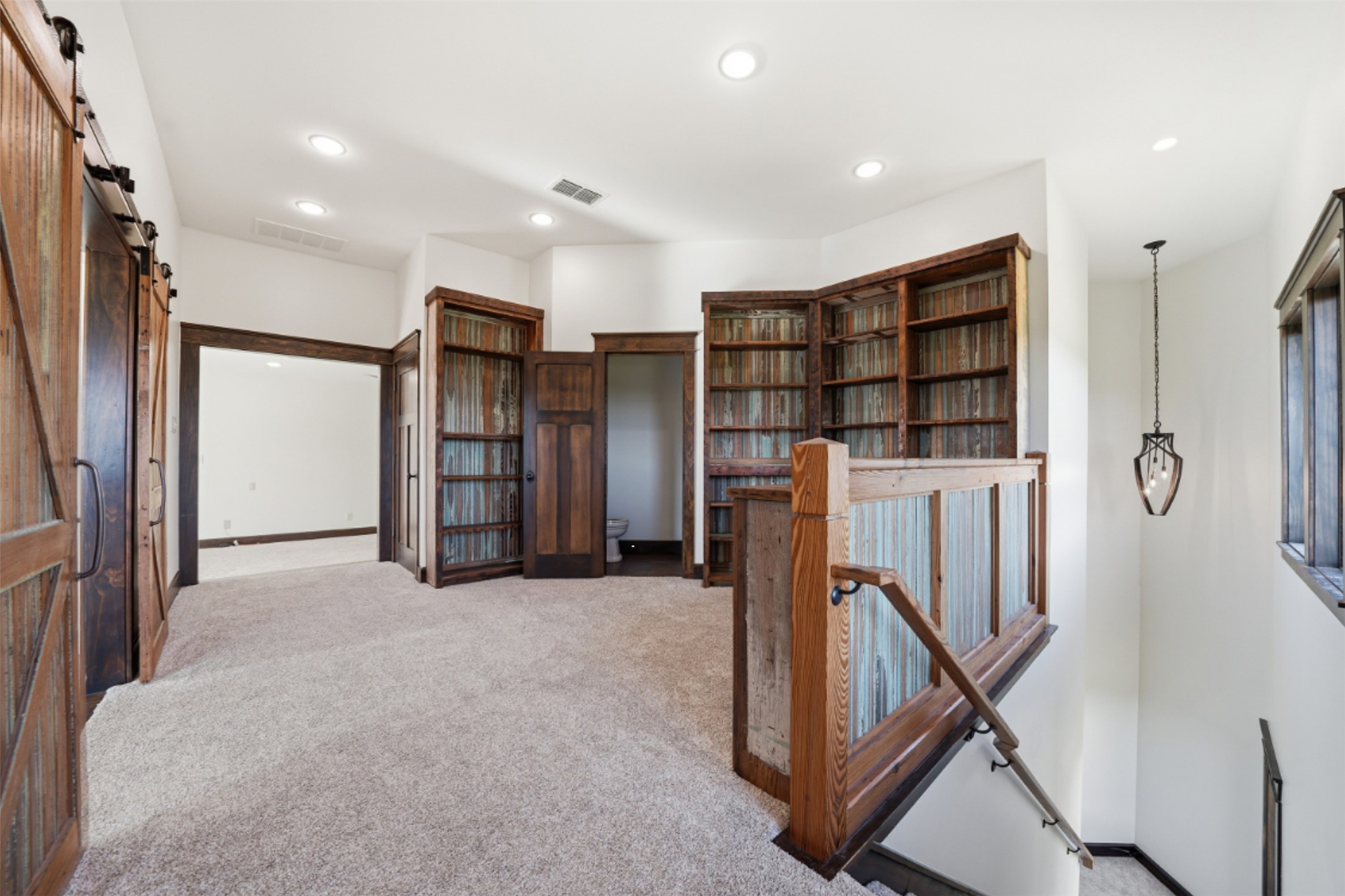 1580 Fm 3237 Wimberley, TX 78676 - Photo 32 of 40 a view of a hall with refrigerator in kitchen and windows