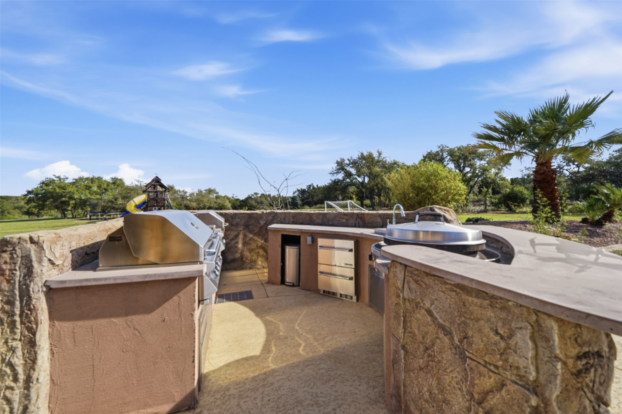 1580 Fm 3237 Wimberley, TX 78676 - Photo 35 of 40 a view of a house with a sink and dishwasher with a potted plant