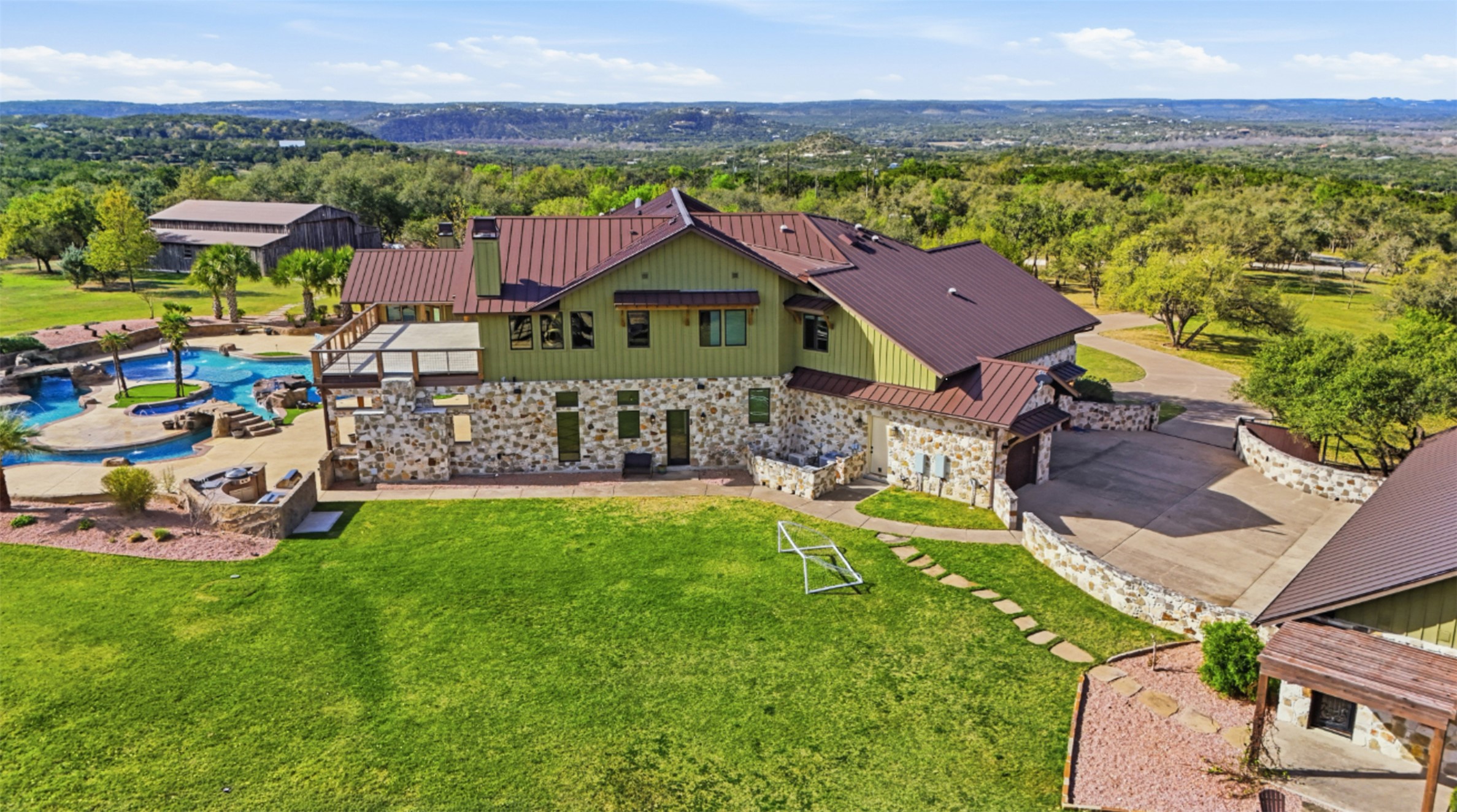 1580 Fm 3237 Wimberley, TX 78676 - Photo 39 of 40 an aerial view of a house with garden