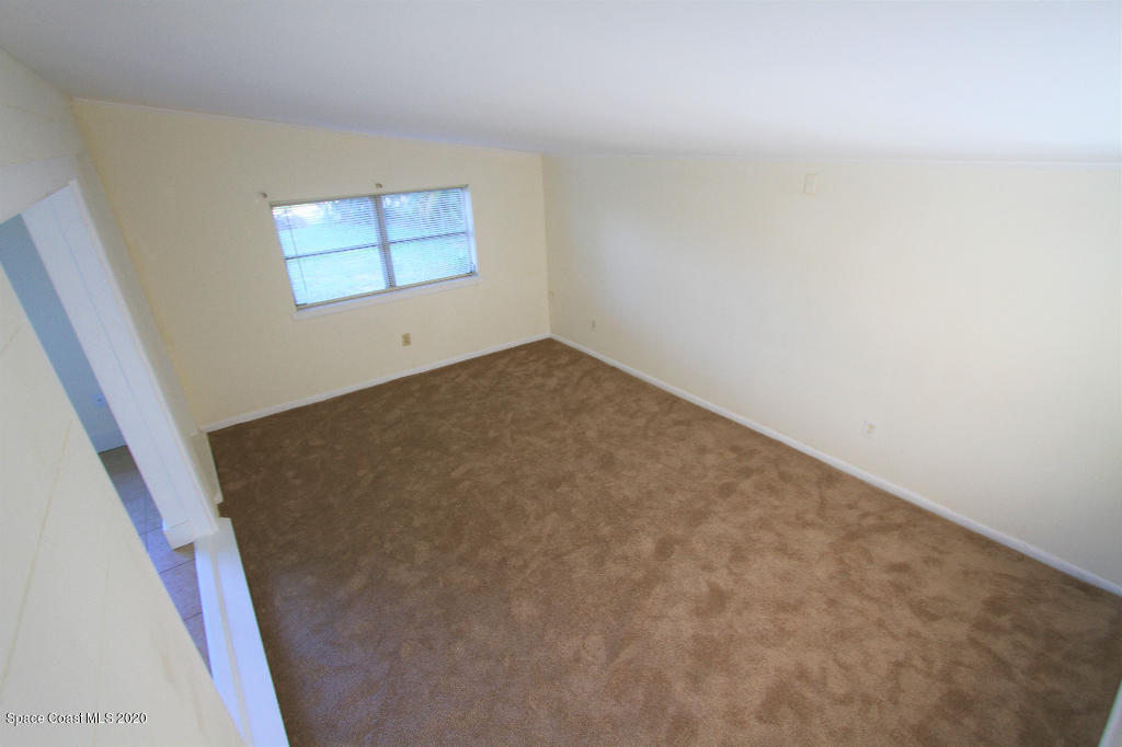 809 8th Street Merritt Island, FL 32953 - Photo 11 of 21 an empty room with windows