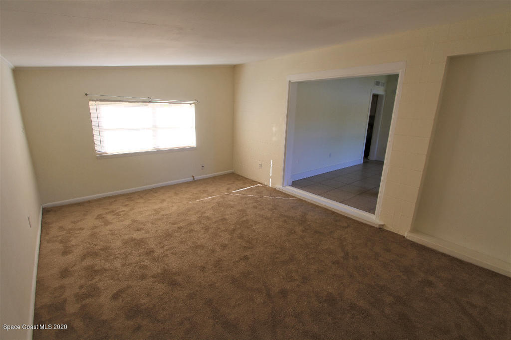 809 8th Street Merritt Island, FL 32953 - Photo 13 of 21 an empty room with windows