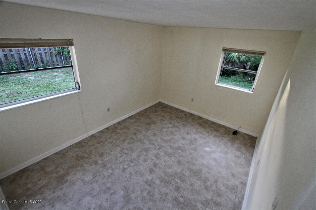 809 8th Street Merritt Island, FL 32953 - Photo 14 of 21 an empty room with windows