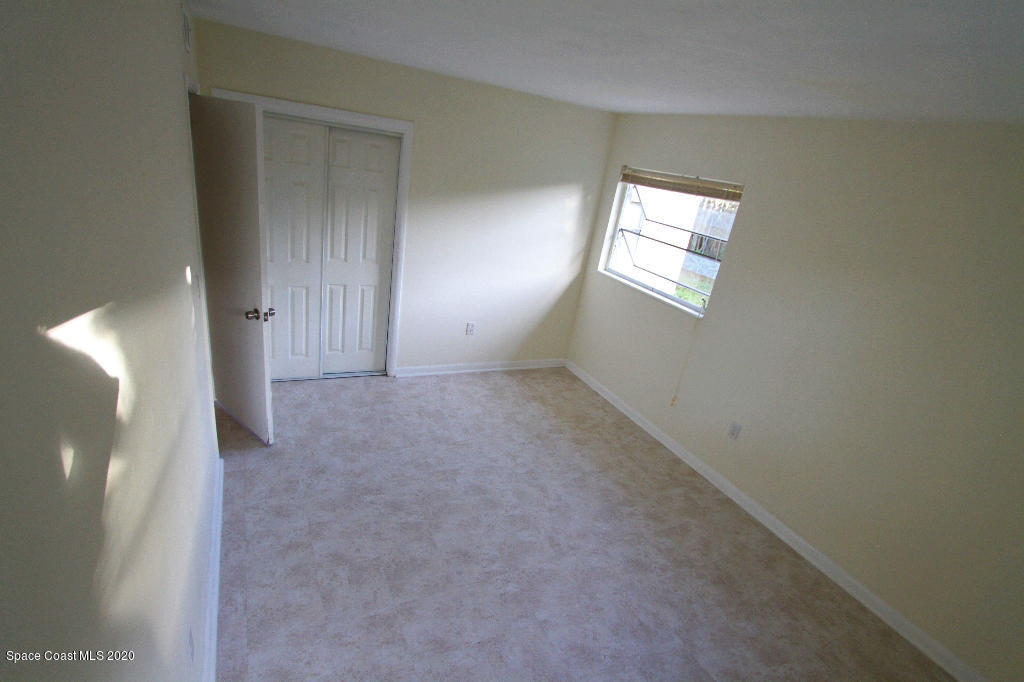 809 8th Street Merritt Island, FL 32953 - Photo 17 of 21 a view of an empty room with windows