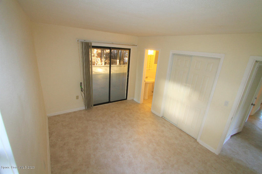 809 8th Street Merritt Island, FL 32953 - Photo 18 of 21 an empty room with windows and closet