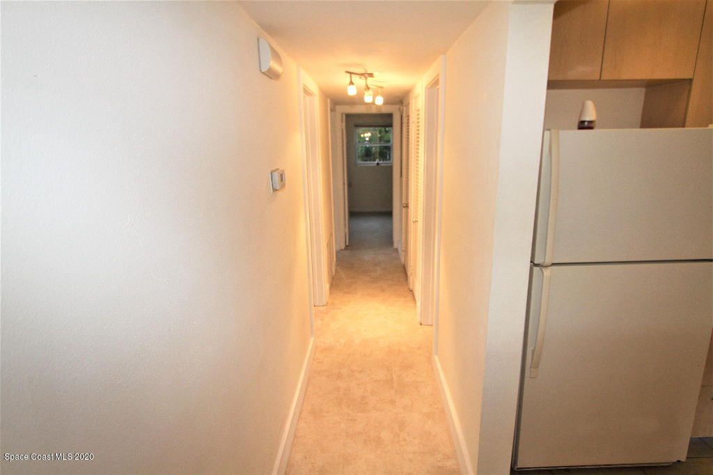 809 8th Street Merritt Island, FL 32953 - Photo 8 of 21 a view of a kitchen from the hallway