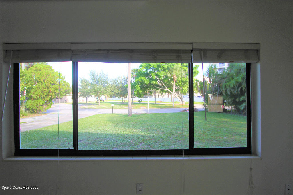 809 8th Street Merritt Island, FL 32953 - Photo 10 of 21 a view of a back yard from a window