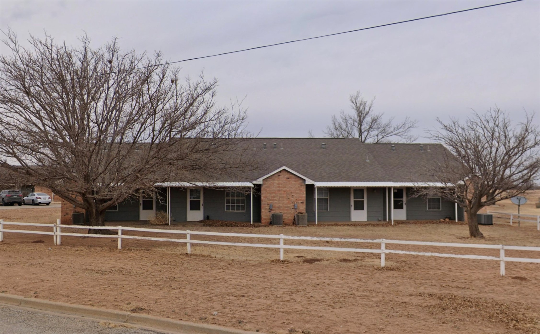 802 West 15th Street Post, TX 79356 - Photo 2 of 6 a house that has a tree in front of it