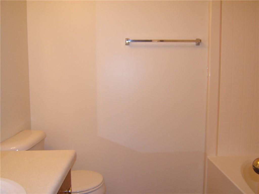 7202 Georges Way Morrow, GA 30260 - Photo 9 of 11 a white toilet sitting next to a shower