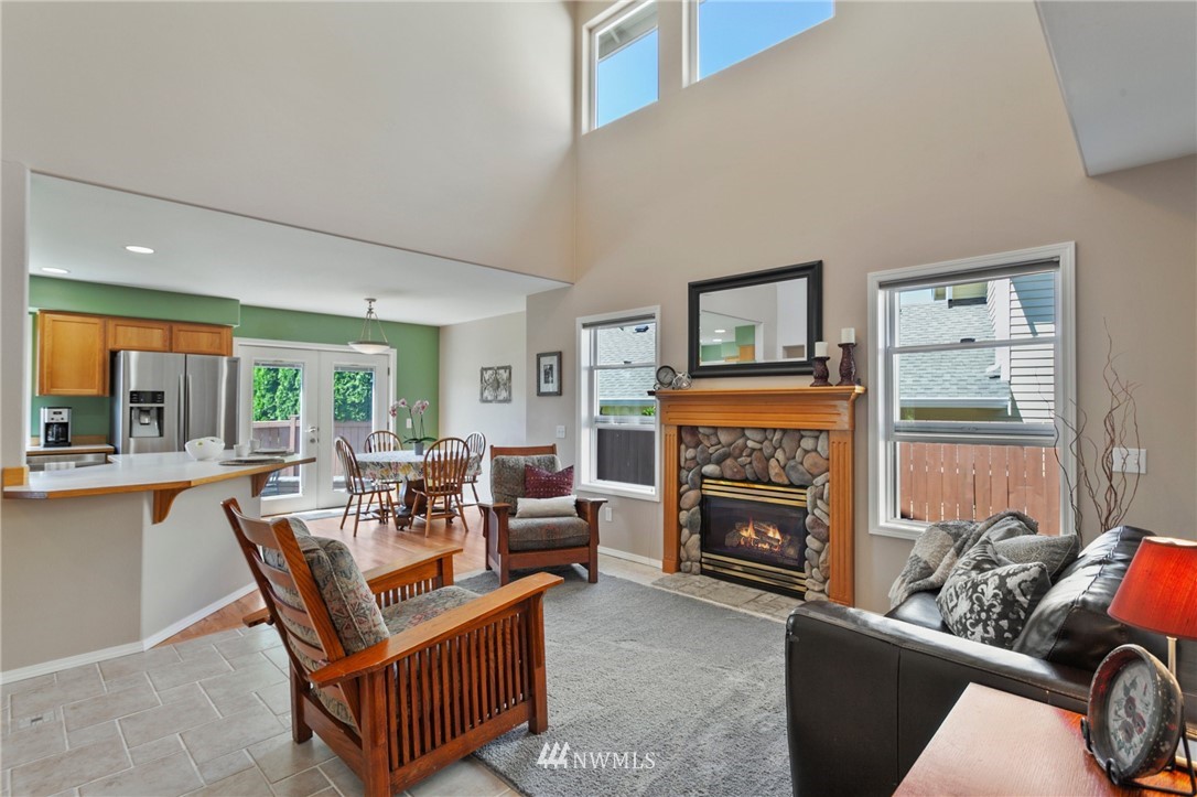 913 232nd Street Southwest Bothell, WA 98021 - Photo 3 of 34 a living room with furniture a fireplace and a large window