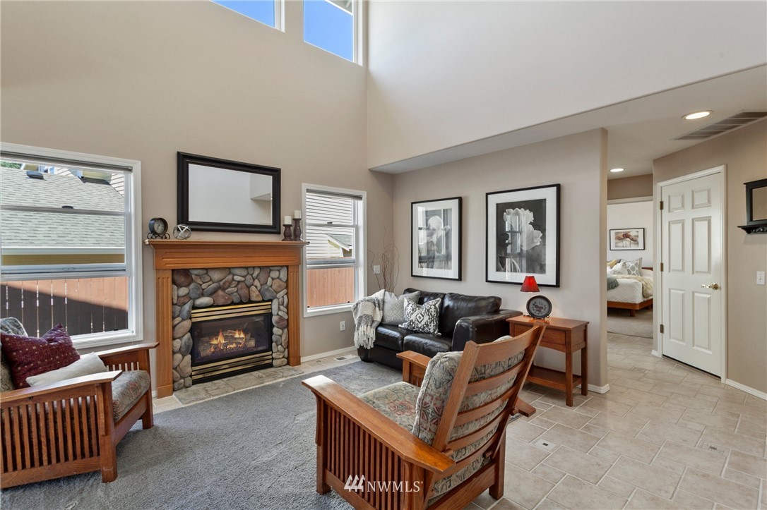 913 232nd Street Southwest Bothell, WA 98021 - Photo 4 of 34 a living room with furniture and a fireplace