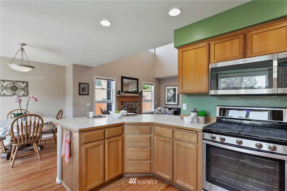 913 232nd Street Southwest Bothell, WA 98021 - Photo 7 of 34 a kitchen with a sink stove and cabinets