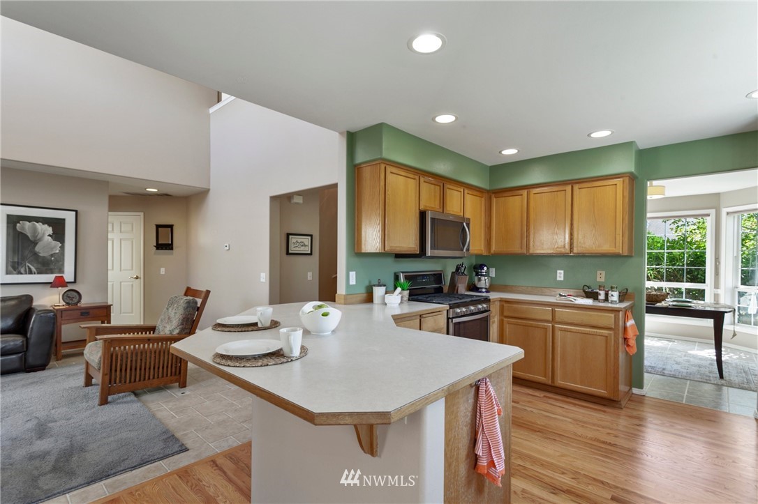 913 232nd Street Southwest Bothell, WA 98021 - Photo 9 of 34 a large kitchen with a table and chairs