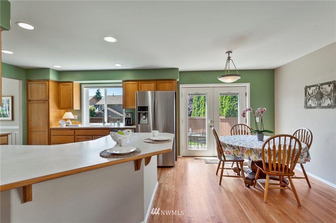 913 232nd Street Southwest Bothell, WA 98021 - Photo 10 of 34 a dining room with furniture window and wooden floor
