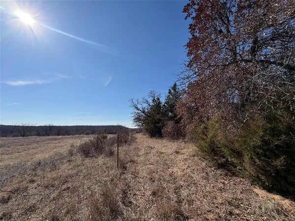 a view of a field with an outdoor space