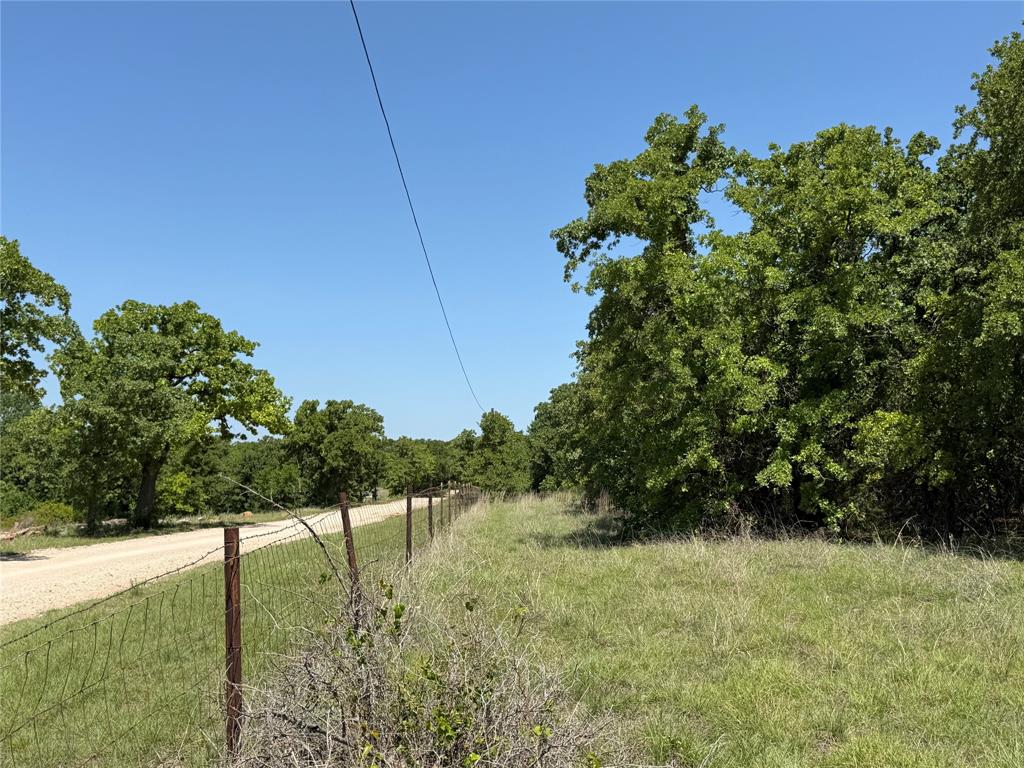 230 Keys Road Sunset, TX 76270 - Photo 11 of 28 a backyard of a house with lots of green space