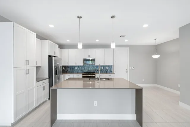 a view of a kitchen with a appliances