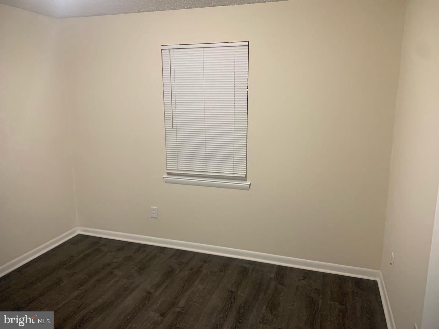 424 Harford Street Perryville, MD 21903 - Photo 18 of 19 an empty room with wooden floor and windows