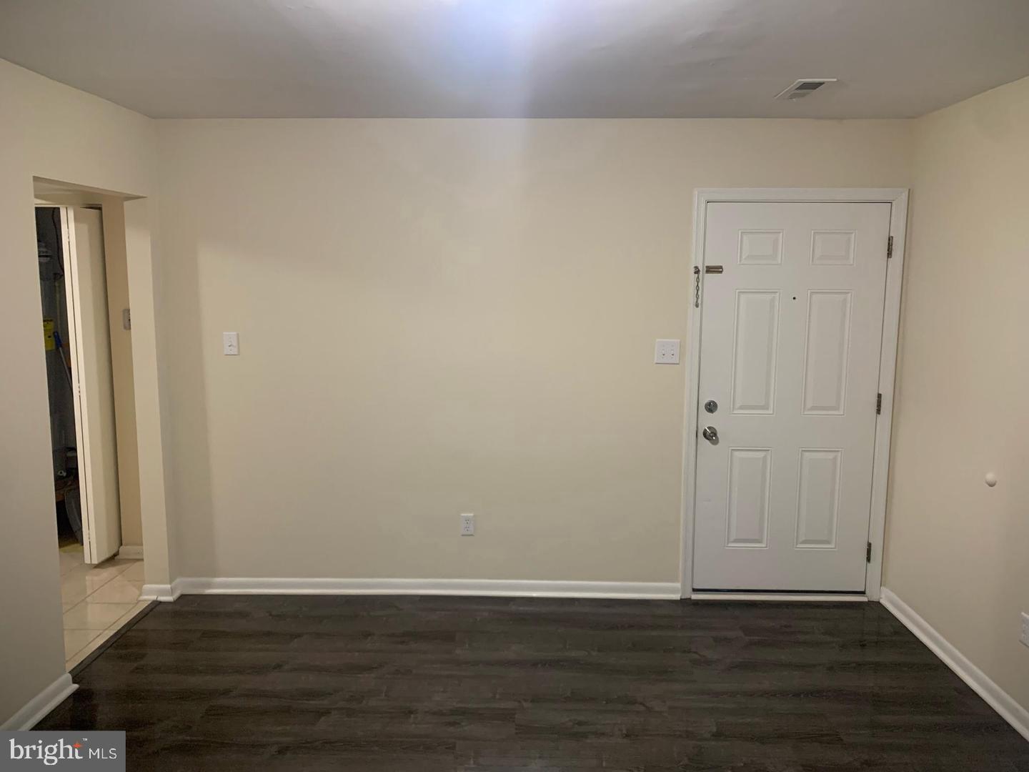 424 Harford Street Perryville, MD 21903 - Photo 6 of 19 a view of an empty room with wooden floor and a window