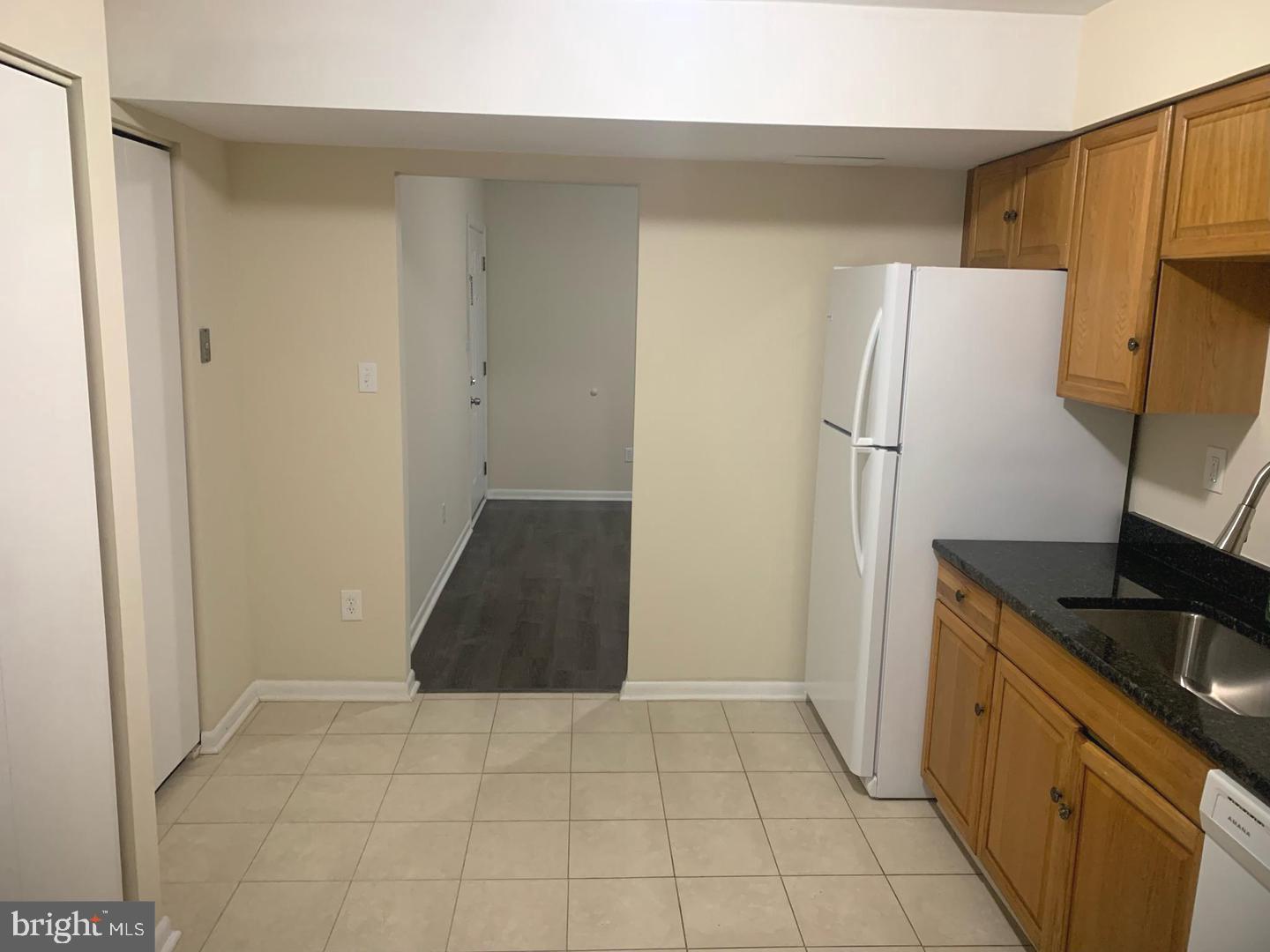 424 Harford Street Perryville, MD 21903 - Photo 7 of 19 a kitchen with a refrigerator and a stove