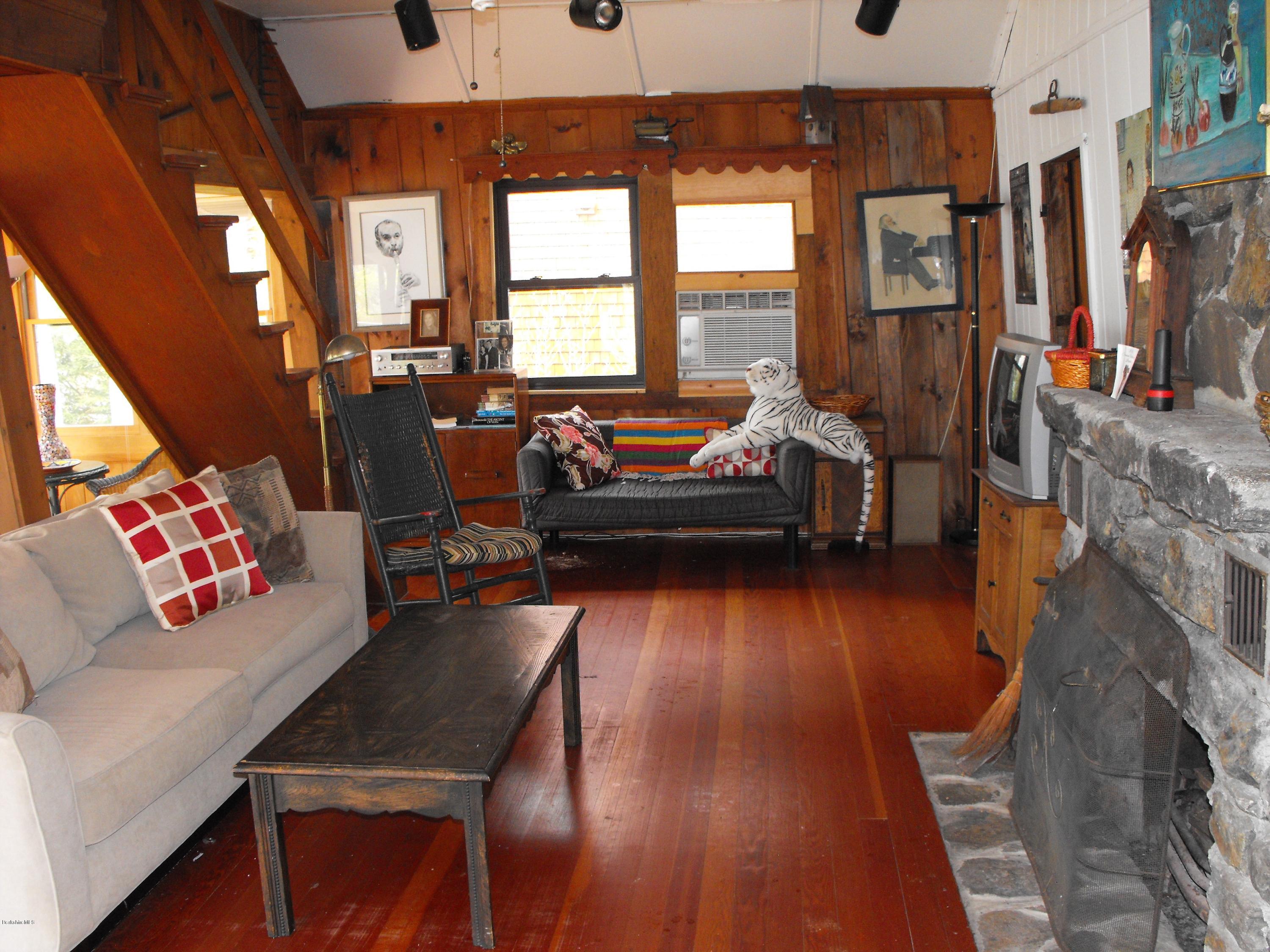 20 Mahkeenac Shores Road Stockbridge, MA 01262 - Photo 7 of 17 Sitting in front of the fireplace