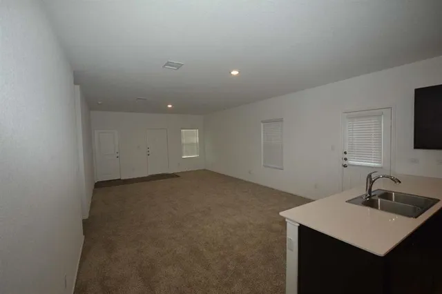a kitchen that has a sink and a stove