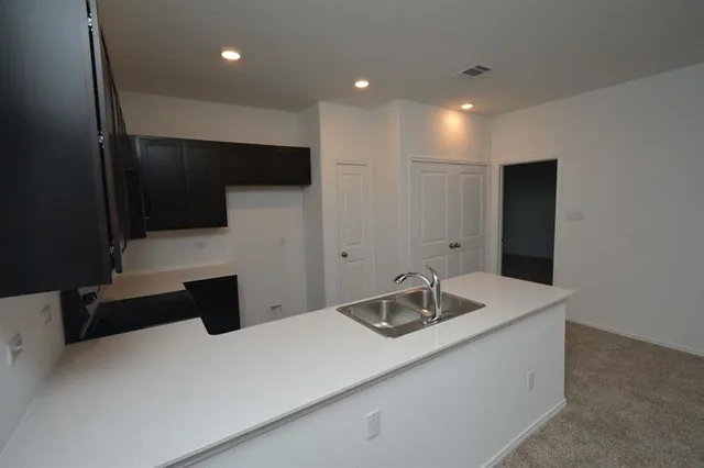 a view of a kitchen with a sink