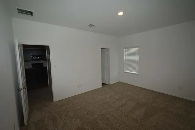 an empty room with closet area