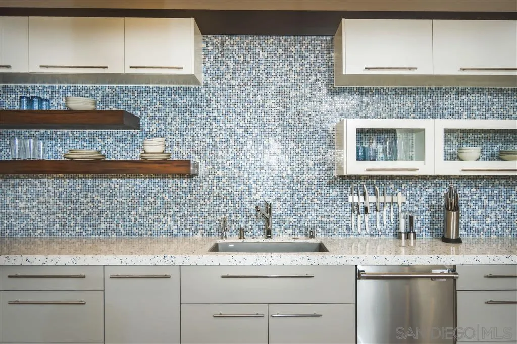 5630 Soledad Road La Jolla, CA 92037 - Photo 12 of 25 a kitchen with a sink and cabinets