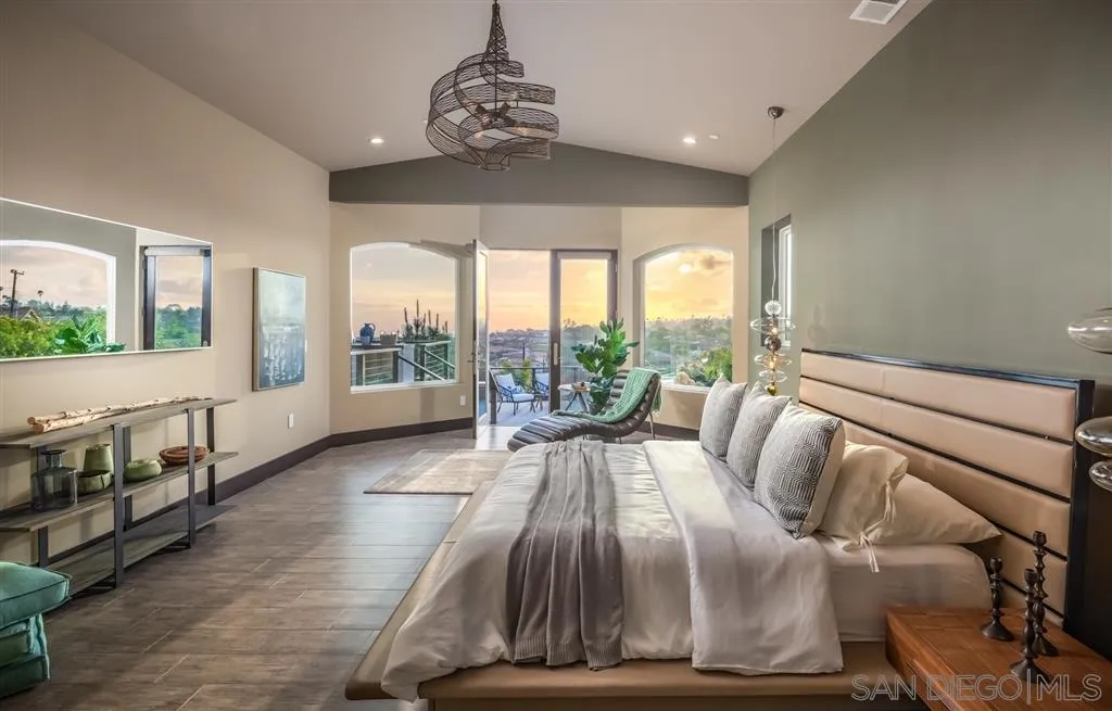5630 Soledad Road La Jolla, CA 92037 - Photo 13 of 25 a spacious bedroom with a large bed and a large window