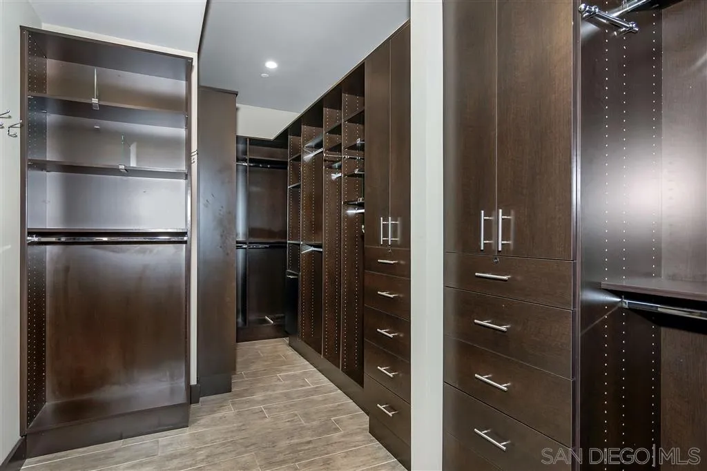 5630 Soledad Road La Jolla, CA 92037 - Photo 15 of 25 a bathroom with a glass shower door
