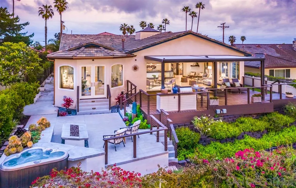 5630 Soledad Road La Jolla, CA 92037 - Photo 21 of 25 a view of a patio with couches table and chairs under an umbrella