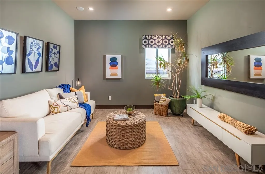 5630 Soledad Road La Jolla, CA 92037 - Photo 9 of 25 a living room with furniture and a flat screen tv