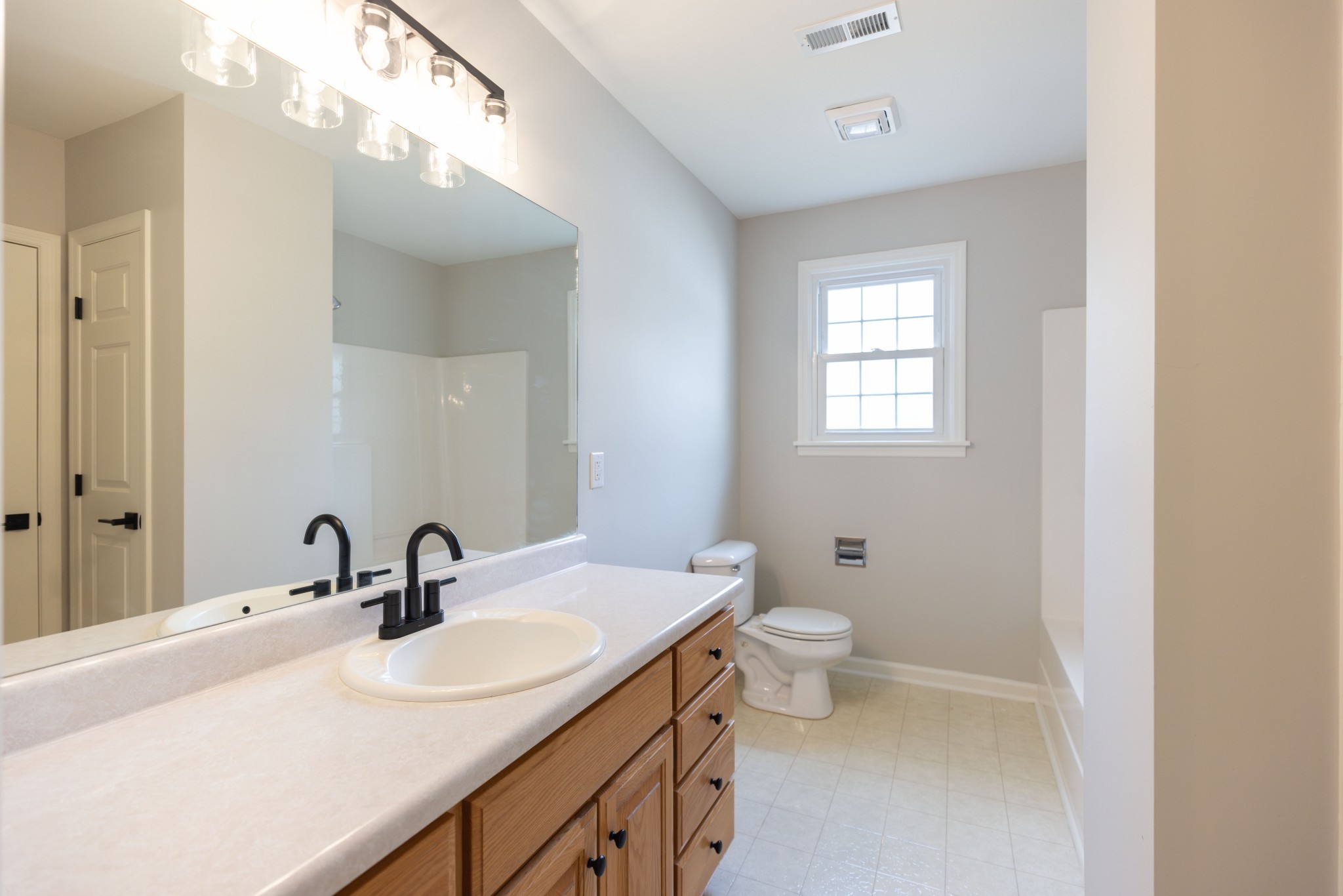 130 Kinneys School Road Springfield, TN 37172 - Photo 9 of 19 a bathroom with a double vanity sink toilet and two mirror