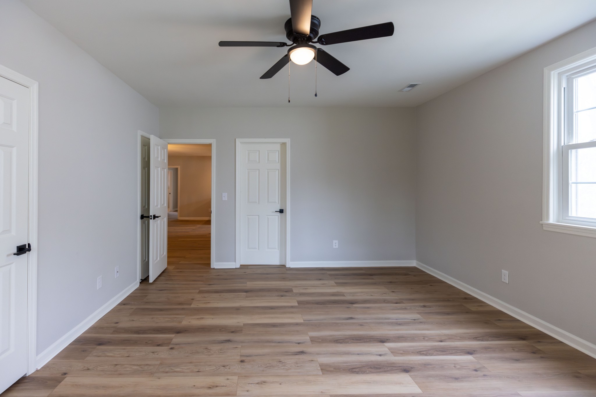 130 Kinneys School Road Springfield, TN 37172 - Photo 10 of 19 a view of empty room with wooden floor and fan